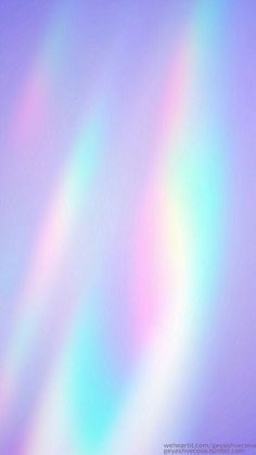 a blurry image of rainbow colors in the sky