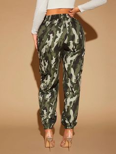 Unleash your inner adventurer with our Camo Print Flap Pocket Cargo Pants. These pants feature a stylish camo print that adds a rugged and military-inspired vibe to your look. The flap pockets provide convenient storage while enhancing the overall aesthetic. Crafted with precision and using high-quality materials, these cargo pants ensure durability and a comfortable fit. Embrace the spirit of adventure with these fashionable and practical cargo pants. Details: Waist Line: High Waist Composition Green Cargo Pocket Joggers For Outdoor, Green Cargo Sweatpants For Outdoor, Combat Cargo Pants For Outdoor, Camouflage Pants With Pockets For Outdoor Activities, Green Joggers With Pockets For Outdoor Activities, Camouflage Bottoms With Multiple Pockets For Fall, Khaki Sweatpants With Pockets For Outdoor, Camouflage Sweatpants With Pockets For Streetwear, Casual Camouflage Cargo Pants For Outdoor