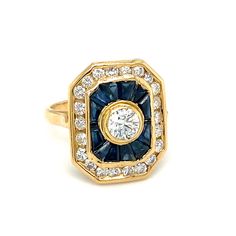 Item Details: This unique ring has a center round diamond in a bezel setting surrounded by sapphires and accent diamonds. It makes for an excellent cocktail or statement ring! Circa: 2000s Metal Type: 18k gold Weight: 5.5g Size: US 4.25, resizable Diamond Details: Carat: Center diamond 0.75cts, accent diamonds 0.25ctw (all approximate) Shape: Round brilliant Color: G-H Clarity: VS-SI   Payment & Refund Details: *More Pictures Available on Request* Payment via Visa/Mastercard/Discover/AmericanExpress, check, money order or PayPal. 7 Day No Hassle Return Policy with 100% Refund (Shipping not included in refund) If you are not happy with your purchase and feel that you would like to return your item within 7 days there is no hassle! We care about our clients and want to make sure every transa Formal Diamond Cluster Ring With Bezel Setting, Emerald Cut Sapphire Ring With Diamond Bezel Setting, Luxury Diamond Cluster Ring With Bezel Setting, Luxury Sapphire Diamond Ring With Bezel Setting, Timeless Sapphire Diamond Ring With Bezel Setting, Sapphire Ring With Diamond Bezel Setting, Yellow Gold Sapphire Ring With Diamond Bezel Setting, Timeless Sapphire Ring With Diamond Center Stone, Formal Sapphire Diamond Ring With Bezel Setting