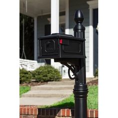 a black mailbox sitting in front of a house