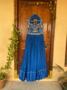 Anarkali suit usa /royal blue anarkali kurta elbow sleeve  / Indian dress with hand embroidery /embroidered anarkali/Indian dresses /blue outfit anarkali dress / blue hand zardosi embroidered designer anarkali         Looking for a perfect indian dress/anarkali/suit sets that are trendy, unique and easy to carry !! yess, You are at the right place. we carry such versatile pieces of anarkalis and suit sets, kurtas that really let you stand out in any occassion !!      featuring this beautiful pure chinnon  and pure raw silk anarkali in beautiful  blue color that has heavy gear and the heavy zardosi hand embroidery all over the body as shown !! A very classy, beautiful yet unique look makes your occasion so Perfect !!Ready to ship in USA !! can be customized in any color !! Details :  - colo Royal Blue Anarkali, Blue Anarkali Dress, Indian Dresses Anarkali, Embroidery Anarkali, Dress Anarkali, Suits Usa, Blue Anarkali, Silk Anarkali, Embroidered Anarkali