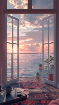 an open window overlooking the ocean at sunset