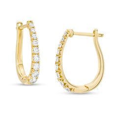 Take your dressy looks to the next level with these dazzling certified diamond hoop earrings. Created in 14K gold, each 17.0 x 12.0mm oval-shaped hoop features a row of sparkling graduated-size diamonds - the largest being 1/20 ct. stones. Each diamond boasts a color rank of H and a clarity of I1. Radiant with 1/2 ct. t.w. of diamonds and a bright polished shine, these earrings secure with hinged backs. This style arrives with a certificate that includes a photo and description of the diamonds, Formal Oval Hoop Earrings With Diamond Accents, Oval Hoop Earrings With Diamond Accents For Formal Events, Oval Hoop Earrings With Diamond Accents For Formal Occasions, Diamond Oval Huggie Earrings Fine Jewelry, Oval Diamond Huggie Earrings Fine Jewelry, Formal Oval Hoop Earrings With Prong Setting, Fine Jewelry Oval Huggie Earrings With Prong Setting, Oval Diamond Huggie Earrings For Anniversary, Oval Huggie Earrings For Formal Occasions