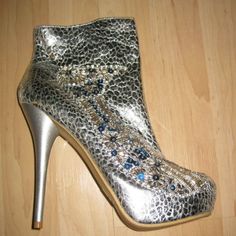 Ankle Boots By Celeste. The Style Is Called Succi-03. They Are Silver Snake Print Embellished With Silver And Turquoise Beads And Sequins. Size 8. Brand New In Box. Heel Measures 5 1/2", Platform Is 1 1/2". Stiletto Heel, Side Zip. I Am Happy To Answer Any Questions. Elegant Party Boots With Metal Feet, Blue Embellished Party Boots, Embellished Blue Party Boots, Rhinestone Ankle Boot Heels For Party, Embellished Ankle Boot Heels For Party, Silver Sequined Boots For Party, Silver Sequined Party Boots, Silver Ankle-high Party Heels, Silver Ankle-high Heels For Party