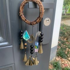 a door with a wreath and bells hanging from it