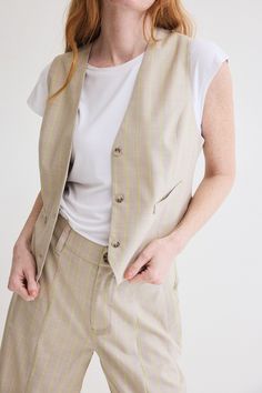 The Tailored For You Vest is the epitome of personalized style and sophistication. Crafted with meticulous attention to detail and superior craftsmanship, this vest is designed to elevate your look with a touch of refinement and individuality. Sleeveless Fastens with button Fitted Hits above the waist