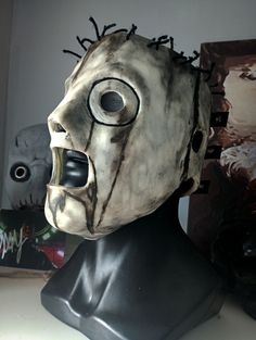 a creepy mask with spikes on its head