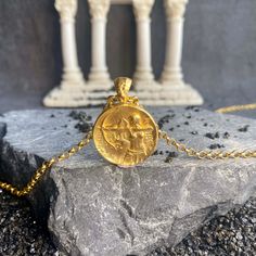 Gold filled Artemis necklace is very meaningful. She is the Olympian goddess of wild animals and nature in Greek mytholog. She was identified by the Romans with Diana. Your minimal gold filled Artemis charm pendant looks very attractive and eye catching with details. Artemis coin medallion will establish emotional connection with you and give you inspiration to find your inner goddess. Artemis Diana necklace made with 925 carat silver and 22 carat gold filled on silver. special greek pendant gif Mythological Engraved Round Pendant Jewelry, Mythological Style Yellow Gold Jewelry As Gift, Mythological Style Yellow Gold Jewelry Gift, Mythological Pendant Necklaces As Gifts, Mythological Medallion Jewelry Gift, Mythological Medallion Jewelry In Gold, Gold Mythological Coin Pendant Jewelry, Mythological Round Pendant Jewelry As Gift, Mythological Round Pendant Necklace For Gifts