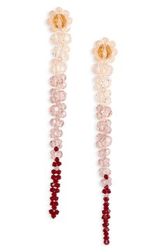 Long, tapered lines of faceted crystals blossom into flowers atop these statement earrings emblematic of Simone Rocha's uniquely romantic aesthetic. Post back Crystal/goldtone plate Made in Portugal Asian & Pacific Islander Owned/Founded Long Earrings Aesthetic, Elegant Faceted Beaded Drop Earrings, Elegant Crystal Beaded Earrings With Round Beads, Elegant Beaded Earrings With Faceted Beads, Simone Rocha Earrings, Elegant Faceted Round Bead Crystal Earrings, Elegant Faceted Beads Crystal Earrings For Party, Elegant Crystal Earrings With Faceted Beads For Party, Elegant Faceted Crystal Earrings