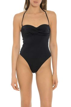 This classy, elegant, and simple one-piece swimsuit is the perfect choice for your next beach visit. Features: This one-piece swimsuit is simple but includes beautiful detail. This swimsuit has a halter style tie to keep it in place. This piece of swimwear offers four-way stretch and is fully lined. If you are looking for a one-piece swimsuit, this is a great choice. The classic and simple style offers a touch of elegance. This Carmen Sol swimsuit comes in two simple colors. Add this swimsuit to Solid Color Swimwear With Knotted Straps For Beachwear, Solid Color Swimwear With Knotted Straps For Poolside, Solid Swimwear With Knotted Straps For Poolside, Elegant Bodysuit With Built-in Bra For Vacation, Fitted Swimwear With Knotted Straps, Elegant Tankini With Built-in Bra For Beach Season, Spaghetti Strap Swimwear With Knotted Straps For Sunbathing, Elegant Pool Tankini With Built-in Bra, Elegant Halter Neck Swimwear For Beach Party