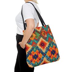 a woman carrying a multicolored tote bag on her left shoulder and back