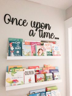 there is a book shelf with books on it and the words once upon at time above it