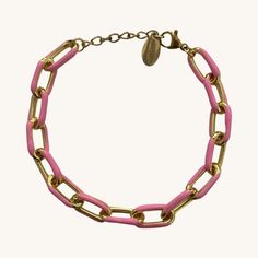 This chain bracelet is such a popular item. You can't go wrong with this fun piece! 14K gold plated with white acrylic overlay 6 inches with 1.5 inch extender and logo charm Trendy Metal Link Charm Bracelet, Trendy Link Chain Bracelet With Lobster Clasp, Trendy Link Bracelets With Lobster Clasp, Pink Link Jewelry With Adjustable Chain, Trendy Gold-tone Link Chain Bracelet, Trendy Link Charm Bracelet With Lobster Clasp, Trendy Metal Charm Bracelet With Extender, Trendy Metal Bracelet With Gold Chain, Trendy Metal Bracelets With Gold Chain