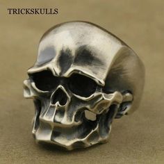 Silver Skulls Skull Boy Ring Modern Retro Biker Punk Rings Size 7 8 9 10 11 New & Sealed Another Great Design Standard For Skull Rings. It Goes From Retro Biker Punk To Smirking Skull Modern. Smooth Detailed Alloy Casting And A High Polish Surface Makes This Ring Versatile And Good For Gifting. Ships Free, New & Sealed In A Black Velvet Jewelry Pouch. See Our Other Items For More Dark Themed Jewelry. Carved Wedding Ring, Boy Ring, Punk Rings, Skull Rings, Stainless Steel Cross Pendant, Mens Stainless Steel Rings, Unique Rings Vintage, Sweet Ring, Diamond Heart Ring