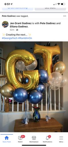 a bunch of balloons that are in the shape of numbers on top of a table