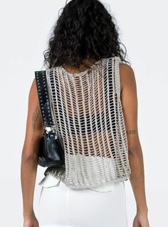 Show off your trendsetter style in this allery crochet knit sleeveless tank. Crafted from lightweight, airy fabric, this stylish tank is perfect for all your summer looks. It's the perfect companion for your shorts, jeans, and skirts! (And yeah, you look totally hot in it). Size Guide: Model is 5’5” tall, and has a 33.1” bust, 24.6”waist, & 37.2” hips. She is wearing a S / US 4 / AU 8. This tank is true to size. Material: 100% Acrylic. Key Features: Relaxed fit. Pull-on. Crochet Knit Fabrication Shorts Jeans, White Crop Top, Color Free, Sleeveless Tank, Summer Looks, Trend Setter, Size Guide, Care Instructions, Gray Color