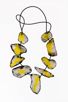 Mixed-Media Necklace - A double necklace, handcrafted from strong, synthetic paper coated with resin featuring a symphony of contrasts! The front showcases radiant yellow and white, while the back captivates in abstract in black and white, creating a layered, collage effect. Connected by a supple rubber cord, the necklace exudes both elegance and boldness. No clasp. Layered Collage, Mixed Media Necklace, Porcelain Necklace, Double Necklace, Paper Earrings, Jewelry Knots, Professional Gifts, Artful Home, Wall Sculpture Art