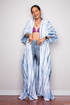 "Tie Dye Robe, Beach Cover, Tie dye Duster Vest, Festival wear, Beach cover up, Lounge wear robe PRODUCT SIZE : One Size Fits Most These are the exact measurements from the robe, measured whilst laying flat >> * Chest : up to 50\" * Waist : 50\" * Hips : 50\" * Sleeve length from neckline to hem : 18\" * Length : 56\" NOTE : * Model chest : 32\", waist : 24\" hips : 35\" * Combined Height is 5\"6 > I'm 5\"2 (158cm) and I'm wearing 4\" heels in the pictures MATERIAL * Rayong (does not st Tie Dye Kimono For Festivals, Tie-dye Kimono With Kimono Sleeves For Festivals, Festival Tie-dye Kimono With Kimono Sleeves, Festival Tie-dye Kimono, Long Summer Kimono With Natural Dye, Oversized Long Beach Robe, Hippie Open Front Kaftan For Vacation, Free Size Bohemian Robe For The Beach, Bohemian Flowy Beach Robe