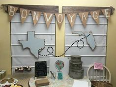 the table is set up for a party with bunting and decorations on it's sides