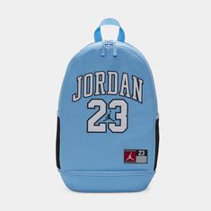 Featuring a graphic inspired by the jerseys Michael Jordan wore, this backpack has a versatile design that you can take from the school to the gym, basketball court or anywhere else you have to bring your haul. The zippered main compartment is nice and spacious, and houses a padded laptop sleeve. Sporty Logo Bags For Streetwear, Casual Sports Bags With Logo, Blue Backpack For Back To School Streetwear, Blue Bags For Back To School Streetwear, Sporty Blue Backpack For Streetwear, Sporty Gym Backpack For Back To School, Blue Back To School Bags, Blue Sporty Backpack For School, Casual Sports Backpack For Back To School