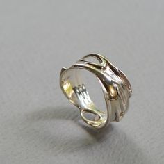 Silver frames stunning opal in this bold and elegant piece. This ring captures the liquidity of forms, as one shape flows into another. An excellent gift for the winter holidays, with its cool, mesmerizing colors. Pair with our Silver and Opal Earrings for the perfect set! Available separately: https://www.etsy.com/il-en/listing/654061483/opal-swirl-earrings-silver-and-opal?ref=shop_home_active_1 -- To see more items from RethinkGold, please visit us at https://www.etsy.com/il-en/shop/RethinkGol Luxury Polished Opal Ring For Gift, Modern Yellow Gold Opal Ring Gift, Elegant Polished Opal Ring Gift, Elegant Polished Opal Ring For Gift, Elegant Opal Open Ring With Polished Finish, Elegant Polished Opal Open Ring, Elegant Open Ring Jewelry With Unique Variations, Elegant Polished Opal Promise Ring, Modern Twist Jewelry Ring With Unique Design