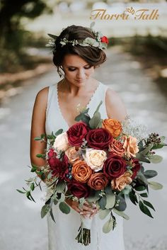 a woman holding a bouquet of flowers in her hands