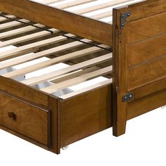 a wooden bed frame with two drawers underneath it and an open drawer under the bed