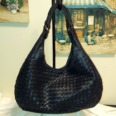 Authentic Bottega Veneta Black Leather Hobo Style Shoulder Bag. Gun Metal Colored Hardware, Magnetic & Dog Leash Closure. Exterior Is In Very Good To Excellent Condition. Loose Threads On Decorative(No Function) Trim Below Strap. Interior Is In Fair To Good Condition. Ink Stains, Spots To Interior Suede Lining. Interior Zip And Open Pockets. No Rips Or Tears To Leather. No Excess Rubbing To Trim Or Bottom. This Is A Very Soft Woven Leather Bag. Please Review Photos As They Are Part Of The Description. Made In Italy. Approx Measurements: 15" Wide At Center, 9" Tall, 9" Drop. Includes Dust Bag. Open To Reasonable Offers. Questions? Leave A Comment Below! Classic Woven Leather Shoulder Bag For Shopping, Classic Intrecciato Shoulder Bag For Shopping, Classic Intrecciato Weave Shoulder Bag For Shopping, Black Double Handle Shoulder Bag With Intrecciato Weave, Black Shoulder Bag With Intrecciato Weave And Double Handle, Black Leather Shoulder Bag With Intrecciato Weave, Black Bags With Intrecciato Weave, Elegant Woven Leather Hobo Bag For Travel, Black Leather Intrecciato Shoulder Bag