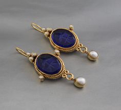 Description Gemstone - Indigo Blue Glass Material - Brass Gemstone Size - 13X18 mm Earring Height Including Hoop - 4.5 cm Earring Width - 2.5 cm Finish - Smooth and high polished with brilliant shine Note -The earrings are made to order, production day is about 3-5 working days. The one you receive may be slight different from the one in the picture due to handmade nature, but it will be almost same as in the above picture.These pieces are handcrafted from start to finish and have an imperfect h Blue Pendant Earrings For Wedding, Blue Pendant Earrings For Gift, Blue Gemstone Pendant Earrings, Blue Round Clip-on Jewelry, Blue Oval Clip-on Earrings, Jewlery Rings, Silver Jewlery, Printed Dress Shirts, Earrings Antique