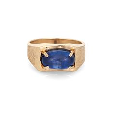 "Stylish vintage natural Ceylon star sapphire ring crafted in 14 karat yellow gold (circa 1970s).  Natural star sapphire, approx. 5.30ct (12.1 x 7.0 x 5.8mm), medium-dark blue color, lightly included, high polish. A faint star is visible under a pinpoint light source. Color and inclusions are typical of star sapphires from Ceylon (Sri Lanka). There is no evidence of any treatments to the stone.  Set in an east to west position, the star sapphire glows in natural sunlight. The gemstone is securely prong set with a florentine finish to the side shoulders. The ring makes a nice statement on the hand. The medium rise ring (7.5mm - 0.29 inches) sits comfortably on the finger.  Included is a report from Guild Laboratories with an \"Estimate of Retail Selling Price New for Comparison Purposes\" - Vintage Oval Sapphire Jewelry, Classic Sapphire Oval Cabochon Jewelry, Vintage Yellow Gold Sapphire Jewelry, Oval Cabochon, Modern 14k Gold Collectible Jewelry, Yellow Gold Sapphire Jewelry Oval Cabochon, Yellow Gold Oval Cabochon Sapphire Jewelry, Collectible Modern 14k Gold Jewelry, Collectible Oval Sapphire Jewelry, Collectible Yellow Gold Sapphire Ring