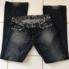 These Are Fantastic! They Have Silver Studs And Black Crystals Mounted In Silver Covering The Whole Waist Band, Going Across The Front Pockets And Covering The Full Flap On Back Pockets. The Are A Dark Blue Distressed With Flare Legs. They Have 32in Inseam. They Have Never Been Worn Or Cleaned. The Distressing Is Great Too. They Are Definitely Some Something Special Jeans Jeans With Crosses On Them, Blingy Jeans, Special Jeans, Dr Wardrobe, Future Wardrobe, Digital Closet, Studded Jeans, Cute Pants, Grey Jeans