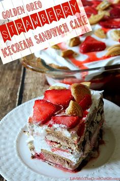 a close up of a piece of cake on a plate with strawberries and nuts