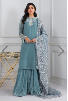 Elevate your formal attire with our Garara suit, a perfect blend of grace and glamour. Crafted from luxurious chiffon fabric, this suit exudes sophistication and elegance. The rich green color adds a touch of regality, making it an ideal choice for special occasions. The intricately designed garara pants offer a contemporary twist to traditional wear, while the organza dupatta drapes gracefully, completing the ensemble. Whether you're attending a wedding, a festive celebration, or a formal event Light Blue Sharara, Sharara Party Wear, Mehndi Suit, Chiffon Sharara, Garara Suit, Chiffon Suit, Bridal Dupatta, Pakistani Party Wear, Shirt Trouser