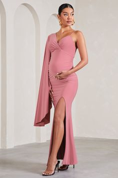 Perfect for baby showers. weddings and everything in between. Rhea is a formal wardrobe must-have. Crafted in a soft pink shade of our signature stretch jersey. this v-neck maternity maxi dress was designed with your comfort at the forefront. Characterised by a singular cape sleeve. Rhea concludes with subtle bump ruching and a high-leg split. Features - Premium stretch jersey- V neckline- Single cape sleeve- Adjustable cami strap- Invisible zip closure - Bump ruching - High-leg split- Maxi leng Dress With Cape, Club L London, Maternity Maxi Dress, Leg Split, Maternity Maxi, Pink Shade, Cape Sleeves, Pregnancy Maxi Dress, Information Design