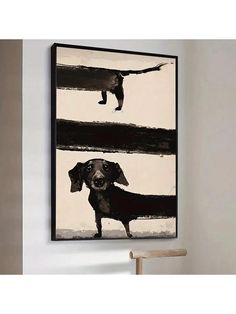 a black and white painting with a dog on it's face hanging above a chair