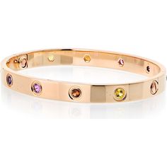 Dive into the depths of luxury, where craftsmanship meets creativity in this stunning Cartier Love 18K Rose Gold Rainbow Bracelet. Encased in the warmth of 18K rose gold, this iconic piece brings the vibrant hues of a rainbow to life, capturing the essence of joy, love, and elegance. Each gem embedded around the bangle is a celebration of color, creating a mesmerizing display that transitions seamlessly from deep greens to rich reds, yellows, and purples. The bracelet's seamless screw motif adds Luxury Multicolor Gold Bracelet, Cartier Luxury Gemstone Jewelry, Luxury Cartier Gemstone Jewelry, Luxury Multicolor Bangle Bracelets, Luxury Multicolor Gold Bracelet As A Gift, Luxury Multicolor Gold Bracelet As Gift, Luxury Multicolor Bangle Bracelet, Luxury Multicolor Gold Bracelet For Gift, Luxury Multi-stone Rose Gold Jewelry