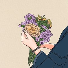 a person holding a bunch of flowers in their hand with the other hand on it