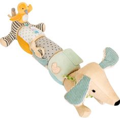 a stuffed toy dog laying on top of another plush animal in blue and white striped shirt