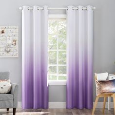 a living room with purple and white curtains