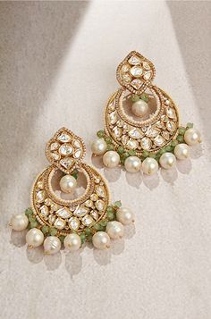 Royal Kundan Polki Chand Baali Earring - Joules By Radhika This designer chand baali earring is handcrafted with multi shaped polkis with baroque pearls & green agates. Ideal to be worn on festive, wedding & party occassions on your Indian & fusion attire.Every artistic piece from Joules by Radhika is made with real semi precious stones only, giving it a regal look & feel. SET INCLUDES: Earrings Details: Handcrafted with ❤️ Metal: Brass Product Type: Earrings Stone: Hydro Polkis, Baroque Pearls, Girly Jewellery, Polki Chandbali, Kundan Chandbali, Bridal Jewellery Online, Hand Jewelry Rings, Polki Earrings, Chandbali Earrings, Bangles Indian, Bangles Jewelry Designs