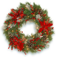 a christmas wreath with pine cones, red berries and lights on the front is shown