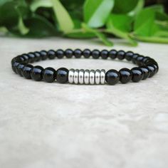 Black Onyx Fidget Bracelet, Healing, Calming 6mm Black Onyx Bracelet, Yoga Strength  Bracelet, Tibetan Jewelry. Male Bracelet, Woman's Men Healing bracelet made with 6mm black onyx gemstones accented with stainless steel disc beads.  The bracelet is  strung on strong elastic cord.   Available in shiny or matte onyx.  Choose when you put it in your cart. BLACK ONYX healing properties: Strength, Stamina, Firmness, Durability and Self-control SIZING INFO: Men's Small - fits wrists measuring 6.5" to Modern Black Bracelets With 8mm Beads, Modern Black Bracelet With 8mm Beads, Modern Black Round Bead Bracelets, Stackable Black Beaded Bracelets, Fidget Bracelet, Yoga Strength, Strength Bracelet, Tibetan Jewelry, Black Onyx Bracelet