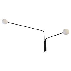 two black and white light fixtures on a white background with no one in the photo