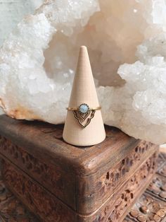 "᛫ 。《 ♢ 》 。᛫ LALIKA Ring * An Indian meaning for \"a graceful woman.\" Brass moonstone ring. Handmade in India with raw brass and moonstone. Perfect for stacking! This ring is one size only - size 8. If you have any questions about this I'd be happy to help!  Raw brass naturally develops a nice antique tinge overtime when in contact with different oils in your skin. I've included a little cloth with your ring and I recommend giving it a polish with water and soap every now and then to keep it nice and shiny :) * MOONSTONE * Calms and balances emotional overreactions. It reminds us that all things are part of an ongoing cycle and enables us to receive direction from the unconscious mind. The ancients believed that a person could read their own future if they put the moonstone in their mouth Adjustable Moonstone Ring With Moon Phase, Adjustable Stackable Moonstone Ring Spiritual, Adjustable Stackable Spiritual Moonstone Ring, Adjustable Ethereal Gemstone Rings, Adjustable Ethereal Moonstone Ring, Ethereal Adjustable Moonstone Ring, Dainty Adjustable Moonstone Crystal Ring, Adjustable Dainty Moonstone Crystal Ring, Adjustable Spiritual Moonstone Promise Ring