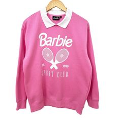 New Without Tag (Nwot). Never Worn. Barbie Brand Tag Is Still Attached. Barbie Sports Club Collared Sweatshirt. Soft Fleece With Brushed Interior. Pink With White Silk-Screened Graphic On Front. 60% Cotton, 40% Polyester Fleece. Machine Wash Cold With Like Colors. Tumble Dry Low. Size: Large Measurements (Flat Across): Shoulders 21” Underarm To Underarm 23” Hem Sweep 18” Sleeve (Shoulder Seam To Cuff) 22” Length (Front, Top Of Shoulder To Hem) 27” Sizing May Run More Similar To Juniors Sizing. P Pink Casual Sweatshirt For Sports Events, Pink Long Sleeve Sports Top, Barbie Sweatshirt, Barbie Shirt, Sports Club, Collared Sweatshirt, Sports Clubs, White Silk, Brand Tags