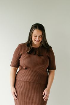 The plus 'Delaney' sweater is what cozy dreams are made of! Made out of the softest ribbed material, the sweater has basic lines, a modest neckline, and comes in a brown color perfect for fall. Pair it with the plus 'Delaney' sweater midi skirt for a set you may never want to take it off! 50% Viscose, 28% Polyester, 22% Nylon Hand Wash Cold Hang or Lay Flat to Dry Do Not Bleach Model Height 5'8" | Wearing Size 1X Please carefully measure a similar item before placing your order to allow for the Sweater Midi Skirt, Modest Neckline, Ribbed Shorts, Short Sleeve Sweater, Layered Tops, Skirt Leggings, Short Sleeved Sweaters, Blouse Dress, Tops For Leggings