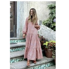 V Neck Dress With Long Sleeves With Elastic Cuffs. Ruffled Hem. Outer Shell 100% Cotton Casual Long Sleeve Pink Maxi Dress, Pink Long Sleeve Maxi Dress For Vacation, Pink Maxi Dress For Fall Vacation, Pink Maxi Dress For Fall, Pink Boho Dress For Beach In Fall, Pink Boho Dress For Fall Beach Occasion, Pink Beach Dress For Fall, Pink Fall Vacation Dress, Fall Flowy Pink Maxi Dress