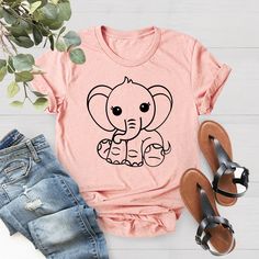 an elephant t - shirt with jeans and sandals