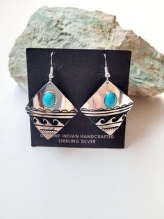 These gorgeous earrings are Navajo handmade handcrafted by artist Elsie Woody. Elsie use to be one of Tommy Singers silversmith's now that he has passed Elsie is still producing his designs in this pair of earrings Elsie has used a piece of sleeping beauty turquoise that is mined in Globe Arizona and underneath the stone she has put the water symbol. The earrings are sterling silver and handstamped the artist has also oxidized behind the water symbol. These earrings are light weight and comforta Artisan Sterling Silver Earrings, Handmade Artisan Sterling Silver Earrings, Artisan Oxidized Dangle Earrings, Artisan Dangle Earrings With Oxidized Finish, Handmade Artisan Silver Earrings, Handmade Silver Artisan Earrings, Bohemian Sterling Silver Earrings Stamped 925, Artisan Turquoise Nickel-free Earrings, Artisan Turquoise Sterling Silver Earrings