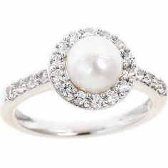 a white pearl and diamond ring